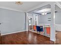 Spacious living room with hardwood floors and decorative columns at 3010 Berry Creek Rd, Charlotte, NC 28214