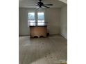 Empty dining room with large window and ceiling fan, vinyl flooring throughout at 116 Morning Glory Ave, Belmont, NC 28012