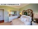 Charming bedroom with a rustic headboard and soft color palette at 125 Sari St, Troutman, NC 28166