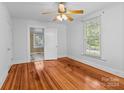 Spacious bedroom with hardwood floors and ceiling fan at 405 7Th St, Spencer, NC 28159