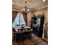 Elegant dining room with a formal table and decorative chandelier at 3486 Mason Spring Dr, Lincolnton, NC 28092