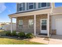 Inviting front entrance with brick facade, covered porch and landscaping at 214 Austen Lakes Dr # 96, York, SC 29745