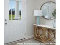 Bright entryway with a wooden console table and a large mirror at 2355 Hedgecliff Rd # 16, Kannapolis, NC 28083