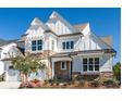 Two-story farmhouse style home with stone accents at 2008 Stratford Ave, Charlotte, NC 28205