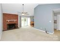 Living room with fireplace and vaulted ceiling at 9408 Vicksburg Park Ct, Charlotte, NC 28210