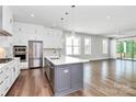 Modern kitchen featuring stainless steel appliances and a large island at 14008 Little Spring Ct # 391, Charlotte, NC 28278