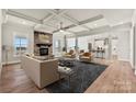 Spacious living room with stone fireplace and open kitchen concept at 207 Coronado Ave # 56, Matthews, NC 28104