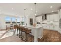 Modern white kitchen with large island at 312 Balboa St # 17, Matthews, NC 28104