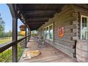 Relaxing front porch with rocking chairs and scenic views at 4796 Dewitt Rd, Blackstock, SC 29014