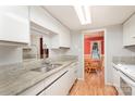 Kitchen with granite countertops and a view into dining area at 8017 Regent Park Ln, Charlotte, NC 28210