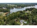 Lakefront property with house and lush surroundings at 130 Bagby Rd, Mooresville, NC 28117