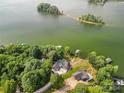 Aerial view of waterfront property with expansive lake views and private dock at 203 High Lake Dr, Statesville, NC 28677