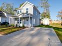 Two-story house exterior with landscaping and driveway at 560 Geneva Cir, Gastonia, NC 28056
