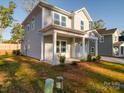 Two-story house exterior with landscaping and driveway at 560 Geneva Cir, Gastonia, NC 28056