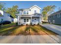 Two-story house exterior with landscaping and driveway at 560 Geneva Cir, Gastonia, NC 28056
