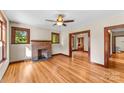 Living room with hardwood floors and brick fireplace at 2523 Kool Park Ne Rd, Hickory, NC 28601