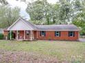 Ranch-style brick home with covered porch at 1918 Waxhaw Hwy, Monroe, NC 28112