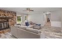 Living room features a stone fireplace and L-shaped sofa at 114 Spargo St, Gastonia, NC 28056