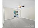Bright bedroom with neutral wall paint, gray carpeting, and ceiling fan at 325 Pelling Dr, York, SC 29745