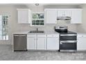 Modern kitchen with white cabinets, stainless steel appliances, and tile flooring at 325 Pelling Dr, York, SC 29745