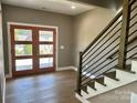 Entryway with modern staircase and double doors at 1243 10Th Street Nw Pl, Hickory, NC 28601
