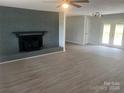 Living room featuring a fireplace and hardwood floors at 201 Rocky River Rd, Oakboro, NC 28129