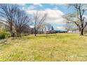 Large backyard with trees and a partly visible house at 185 17Th Se St, Hickory, NC 28602