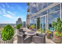 Spacious balcony with city views and seating area at 215 N Pine St # 3705, Charlotte, NC 28202