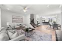 Spacious living room with a staircase and large art piece at 3109 Colyer Pl, Charlotte, NC 28205