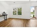 Bright living room with hardwood floors and large windows at 4169 Oconnell St, Indian Trail, NC 28079