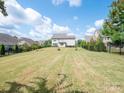 Large backyard with expansive lawn and privacy fence at 775 Kathy Dianne Dr, Fort Mill, SC 29707