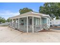 Light blue home with covered porch and ample parking at 172 Cardinal Dr, New London, NC 27371