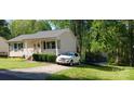 House with driveway, and a trampoline in the backyard at 721 A St, Bessemer City, NC 28016