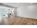 Bright living area with hardwood floors and kitchen views at 2235 Hedgecliff Rd # 4, Kannapolis, NC 28025