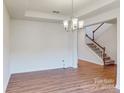 Dining room with hardwood floors, leading to the staircase at 233 Winford Rd, Troutman, NC 28116