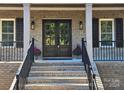 Double front doors with sidelights and black railings at 444 19Th Avenue Nw Cir, Hickory, NC 28601