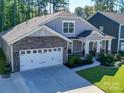 Two-story house with a two-car garage and nicely landscaped yard at 2716 Manor Stone Way, Indian Trail, NC 28079