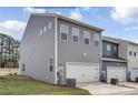 Gray townhouse with a two-car garage and landscaping at 1110 Bartholdi Dr # 1001, Gastonia, NC 28054