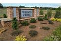 Wilson Creek community entrance with stone sign and landscaping at 5276 Scotts Creek Rd, Indian Land, SC 29707