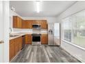 Kitchen with stainless steel appliances and wood cabinets at 1584 Arborgate Dr # 90, Rock Hill, SC 29732