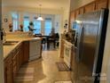 Kitchen with stainless steel appliances and wood cabinets at 4016 Holly Villa Cir, Indian Trail, NC 28079