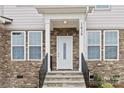 Inviting front entrance with stone accents at 1038 Heath Helms Rd, Monroe, NC 28110