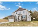 Two-story house with stone accents and a two-car garage at 1038 Heath Helms Rd, Monroe, NC 28110