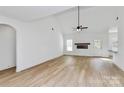 Bright living room with vaulted ceiling, fireplace, and vinyl plank flooring at 2059 Parks Rd, Salisbury, NC 28147