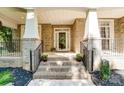 Brick front porch with steps leading to the front entrance of the home at 1321 Linden Glen Dr, Matthews, NC 28104