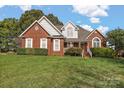 Brick home with landscaped yard at 2488 Birdie Ne Ln, Conover, NC 28613
