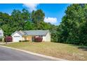 House exterior view with green trees and a paved driveway at 2563 Clover Nw Rd, Concord, NC 28027