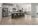 Modern kitchen with a large island and stainless steel appliances at 5313 Mint Harbor Way # 0312, Charlotte, NC 28269
