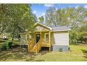 Tan house exterior with new porch and steps at 804 Sowell St, Lancaster, SC 29720