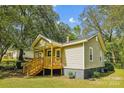 Charming craftsman style home with a large front yard and wooden porch at 804 Sowell St, Lancaster, SC 29720